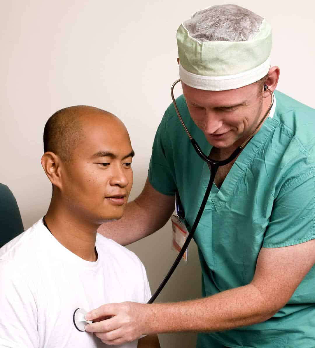 Doctor using a stethoscope on a patient checkup